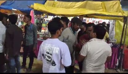 Fight between two groups to sit in the front and watch the performance