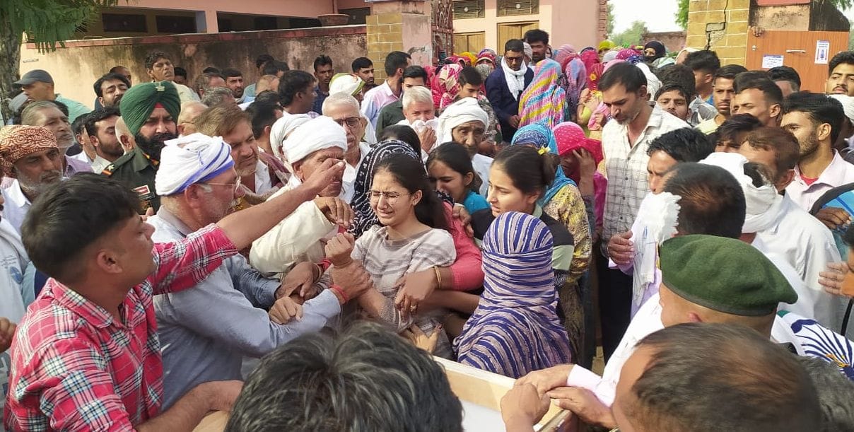 Villagers and army personnel bid last farewell to Havildar Rakesh Kumar in village Barada.