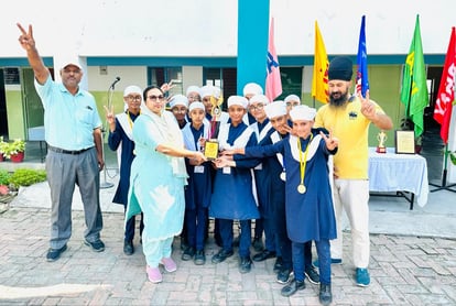 Children hoisted the flag in the athletic meet held in Etah