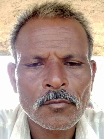 Village head sleeping in the house was murdered by cutting him with an axe.