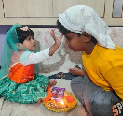 Sisters took a pledge to protect their brothers by applying tilak on their forehead.