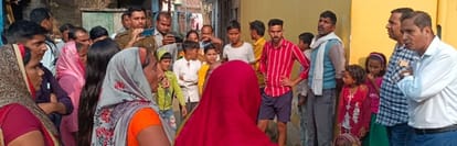 Demonstration by lying down in front of JCB machine