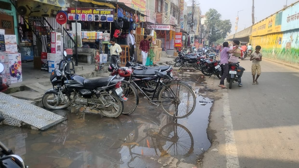 City drains jammed, water spread on the road