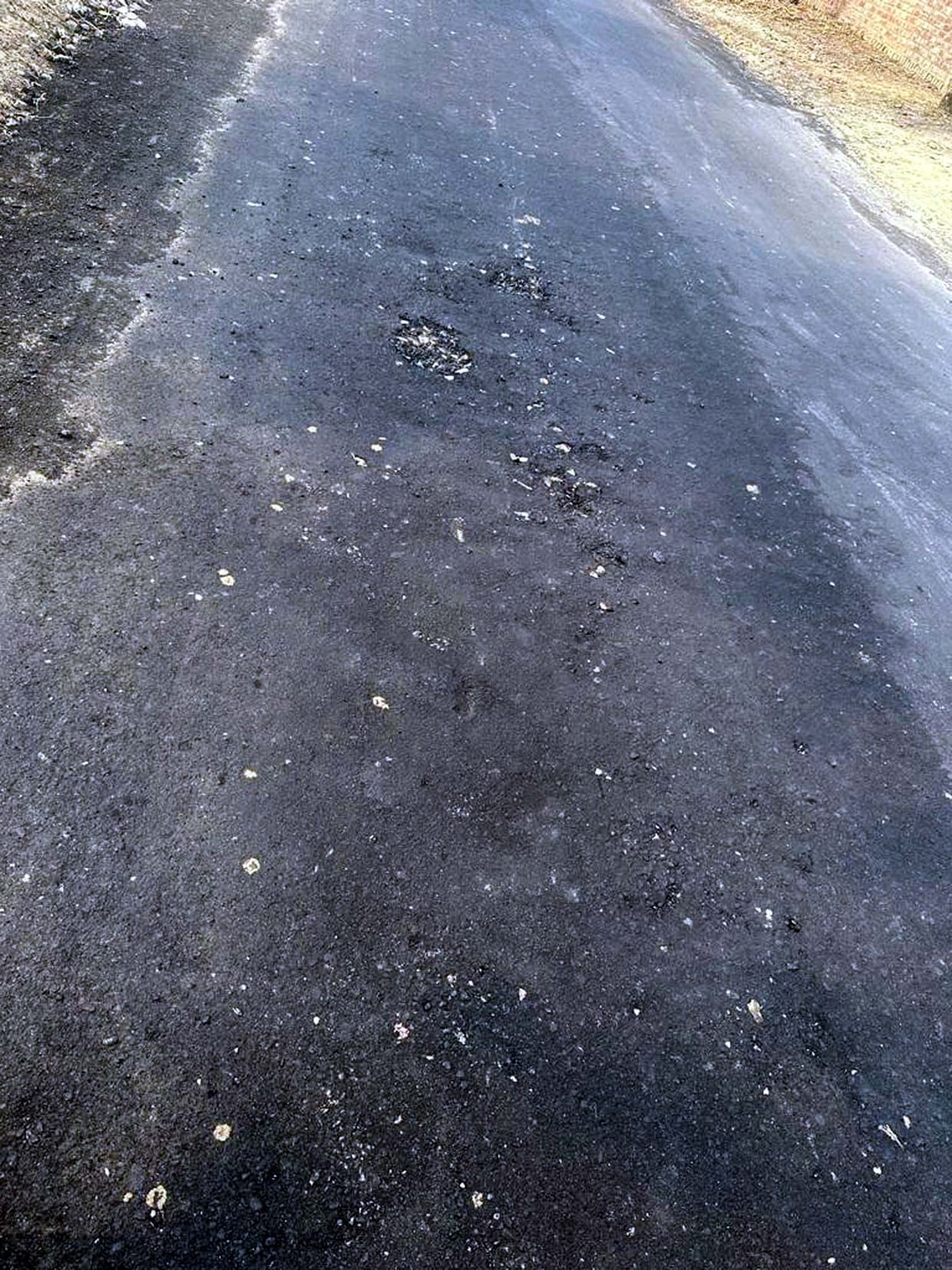 Villagers accused of poor construction material in the roads, SDO reached the spot and said that he will get the bad patches repaired again