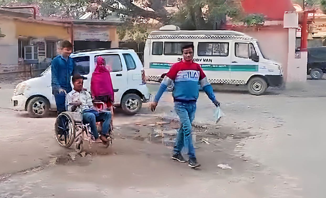 Employees are present, yet attendants are bringing patients in wheelchairs