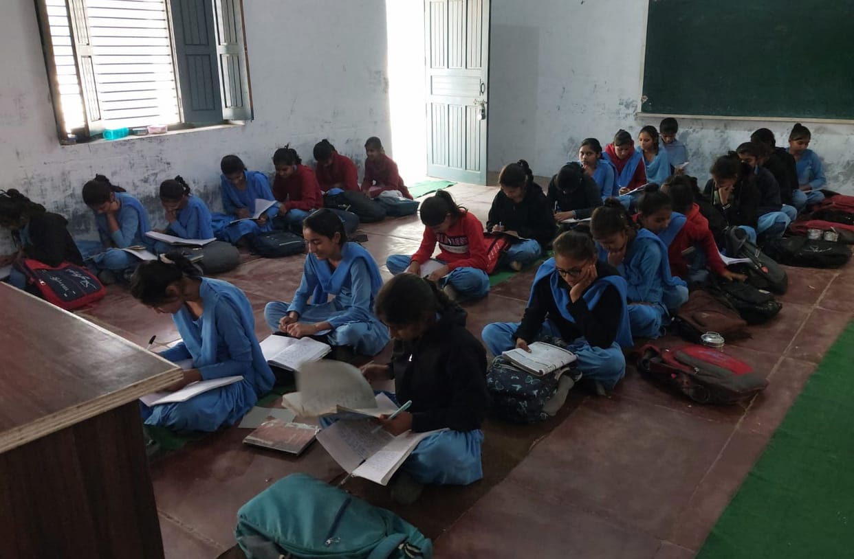 Study is taking place while sitting on the cold floor, windows and doors in the rooms are also broken