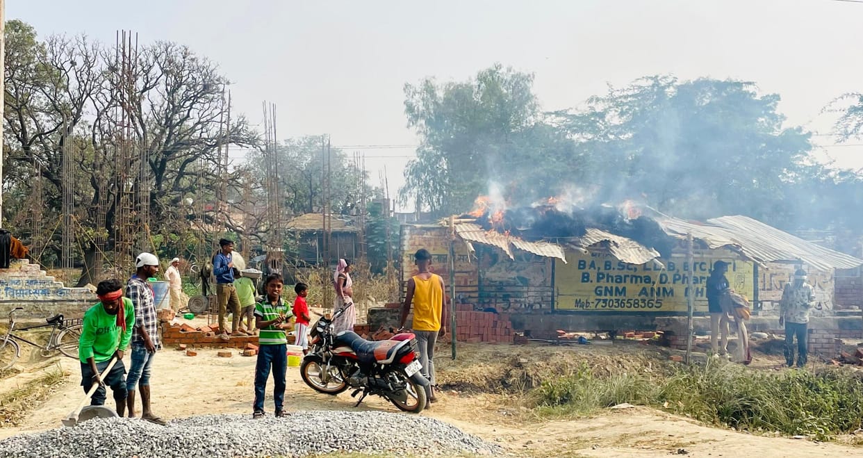 The hut was set on fire after demolishing the wall of the building under construction.