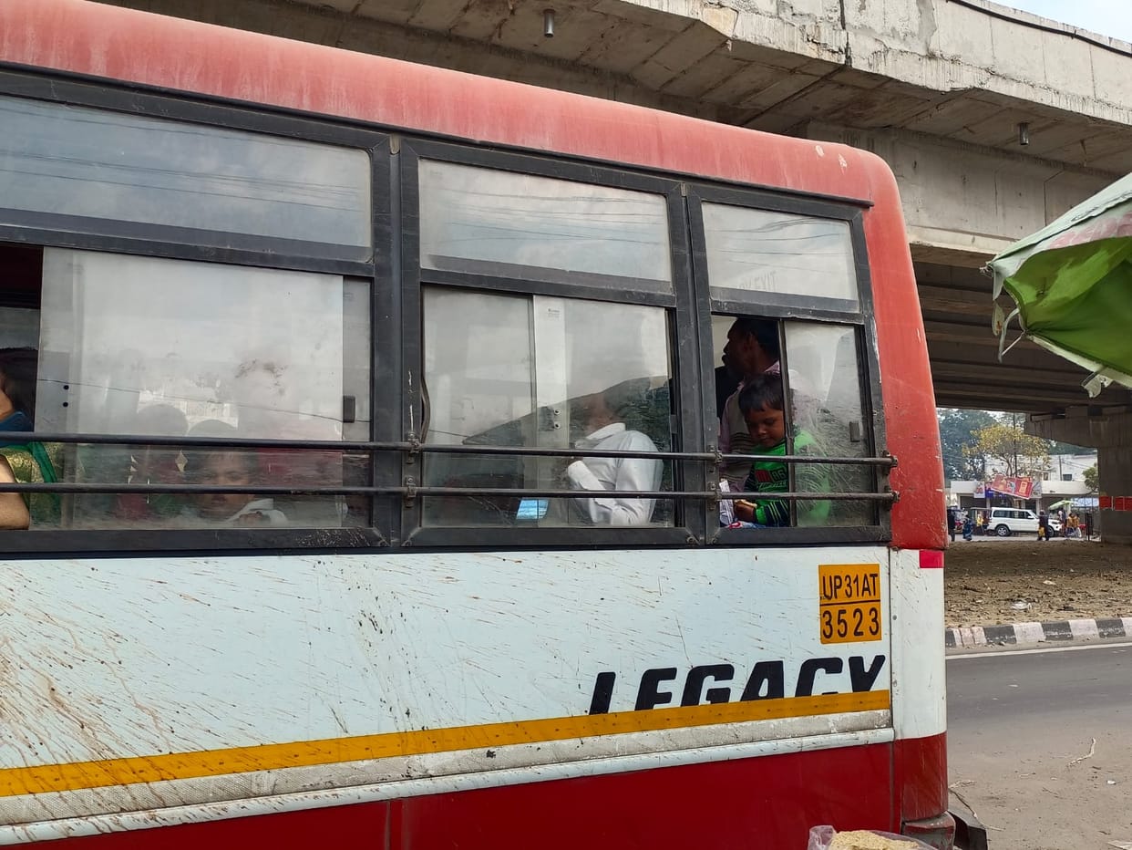 Cold wind entering through broken glass, passengers shivering while travelling.