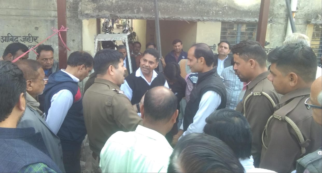 Advocates protest against putting up tin shed, police stops the work