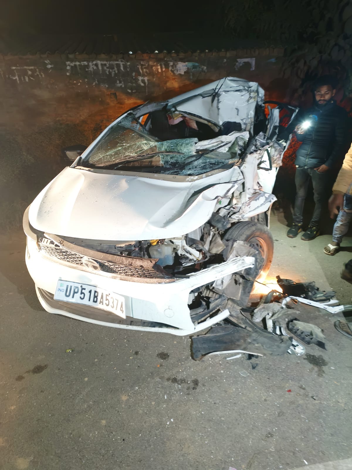 Car collides with parked truck, three wedding guests including groom's brother injured