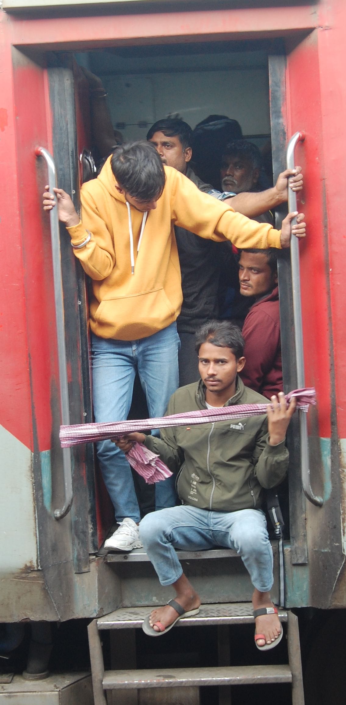 Struggle to board the bogies...complete the journey standing