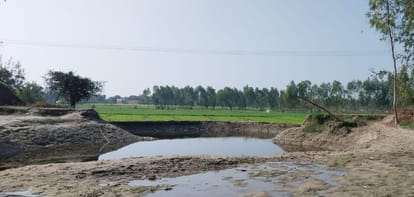 Road washed away in flood, people forced to cross the road with tractor