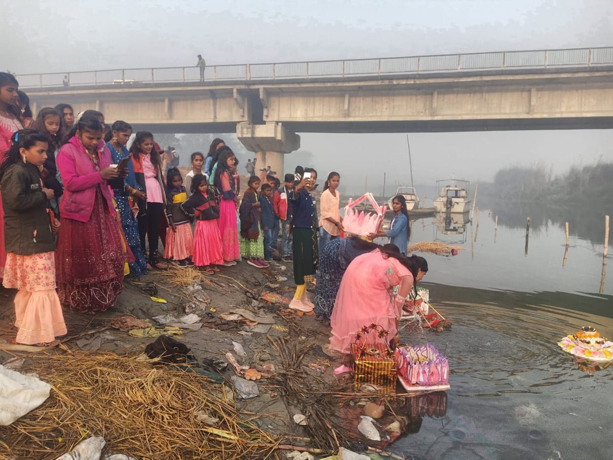 Girls immersed their balls in Gandak river.