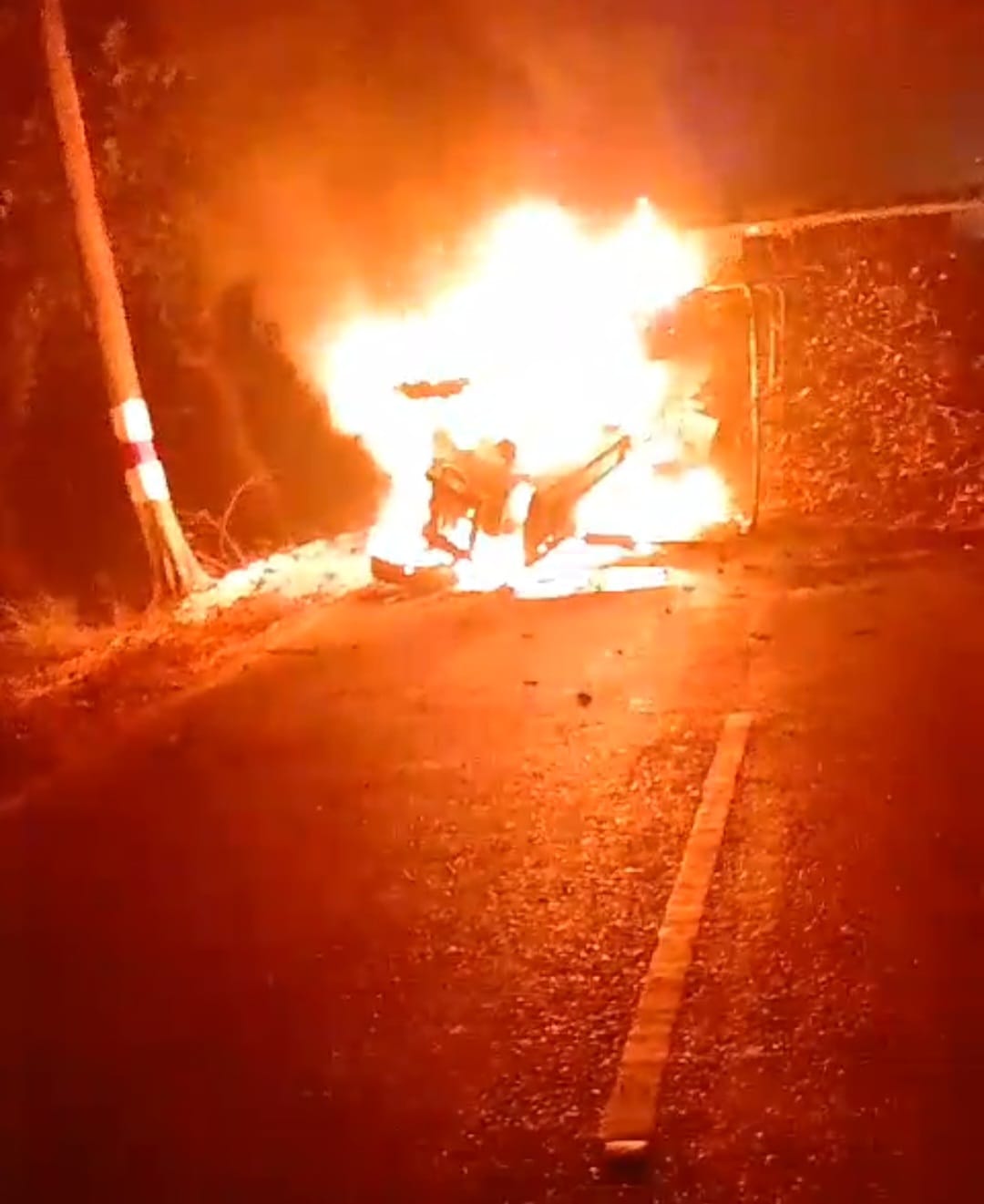 Trailer overturns out of control, tractor catches fire