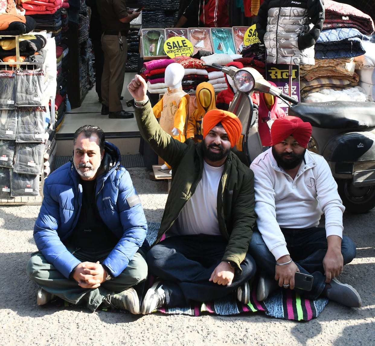 Traders sitting on dharna at shop over transaction dispute