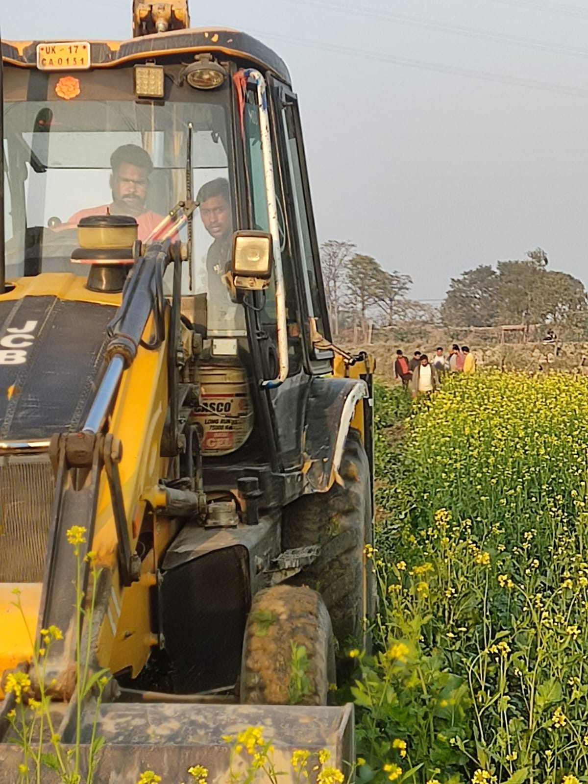 Administration's bulldozer runs on crops standing on government land in Ganga Khadar