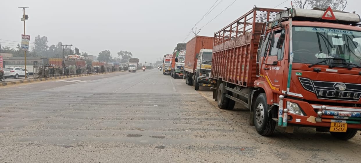 Due to closure of the highway, trucks remained standing on the tracks throughout the day on Saturday.