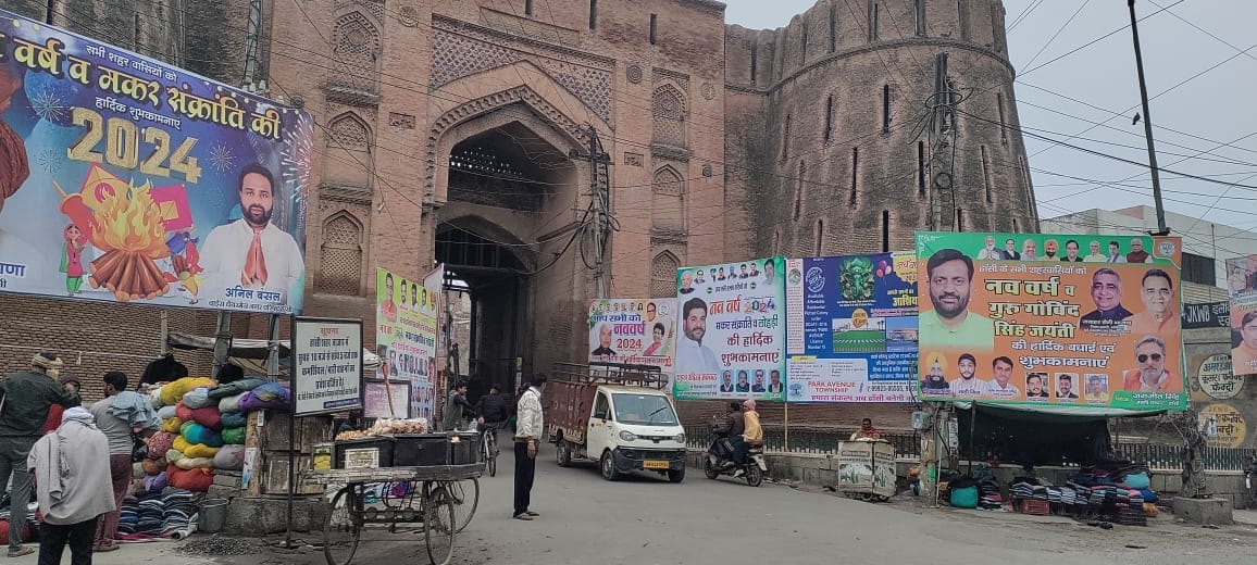 Historic Badsi Gate covered with greetings from politicians, no action taken on issue of fine