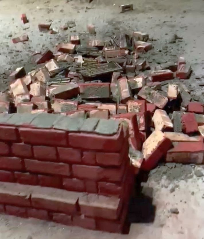 Stone slab broken before laying foundation stone of traffic light