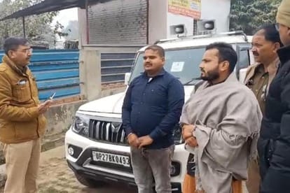 Car fitted with hooter parked at the gate of Tilhar police station