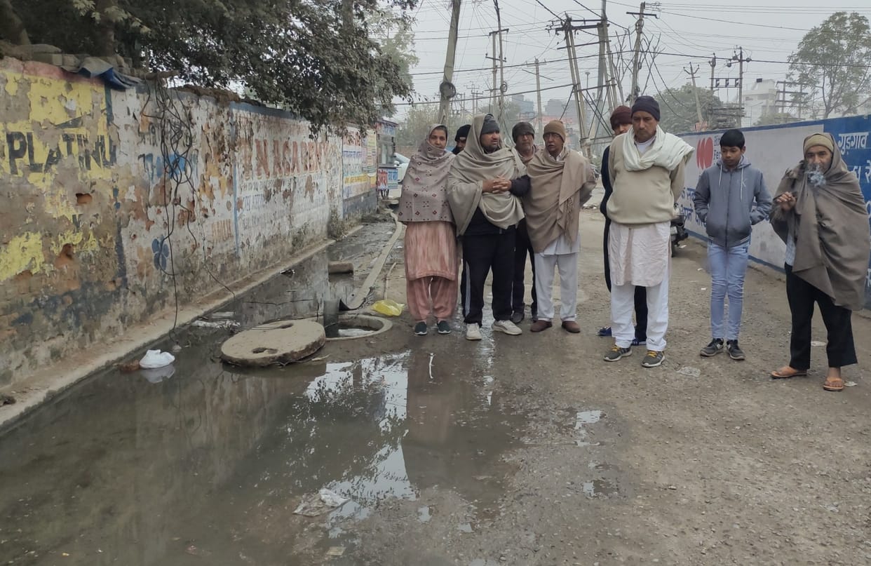 Water filled streets due to sewer overflow in Devnagar