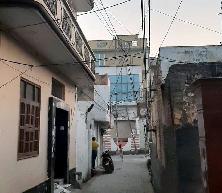 Electric wires hanging in the streets, people worried
