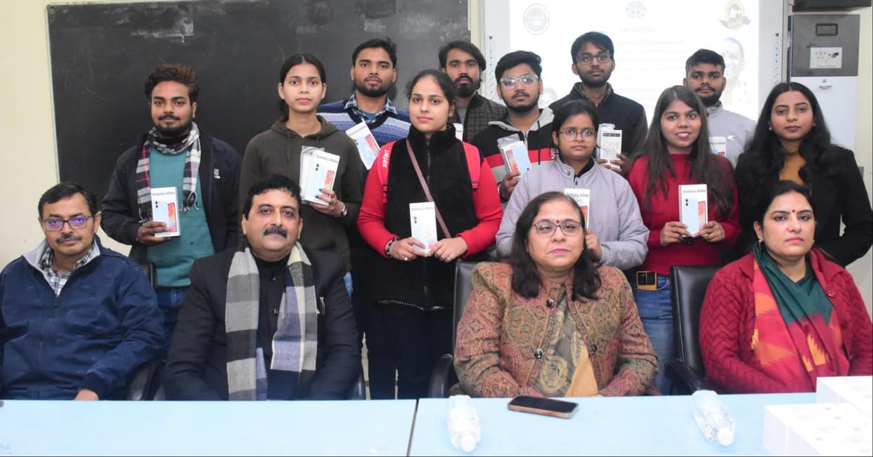 Mobiles distributed to students of DDU Commerce Department