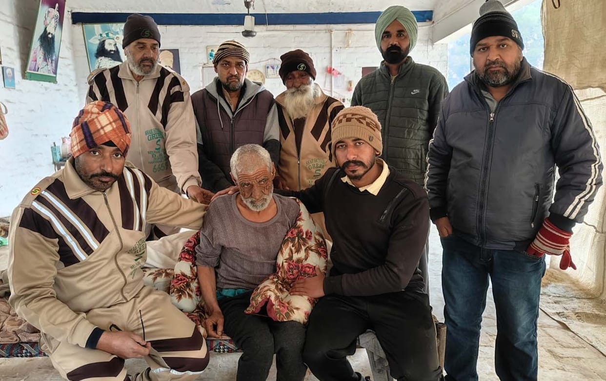An elderly man found lying on the roadside in extreme cold was reunited with his family.