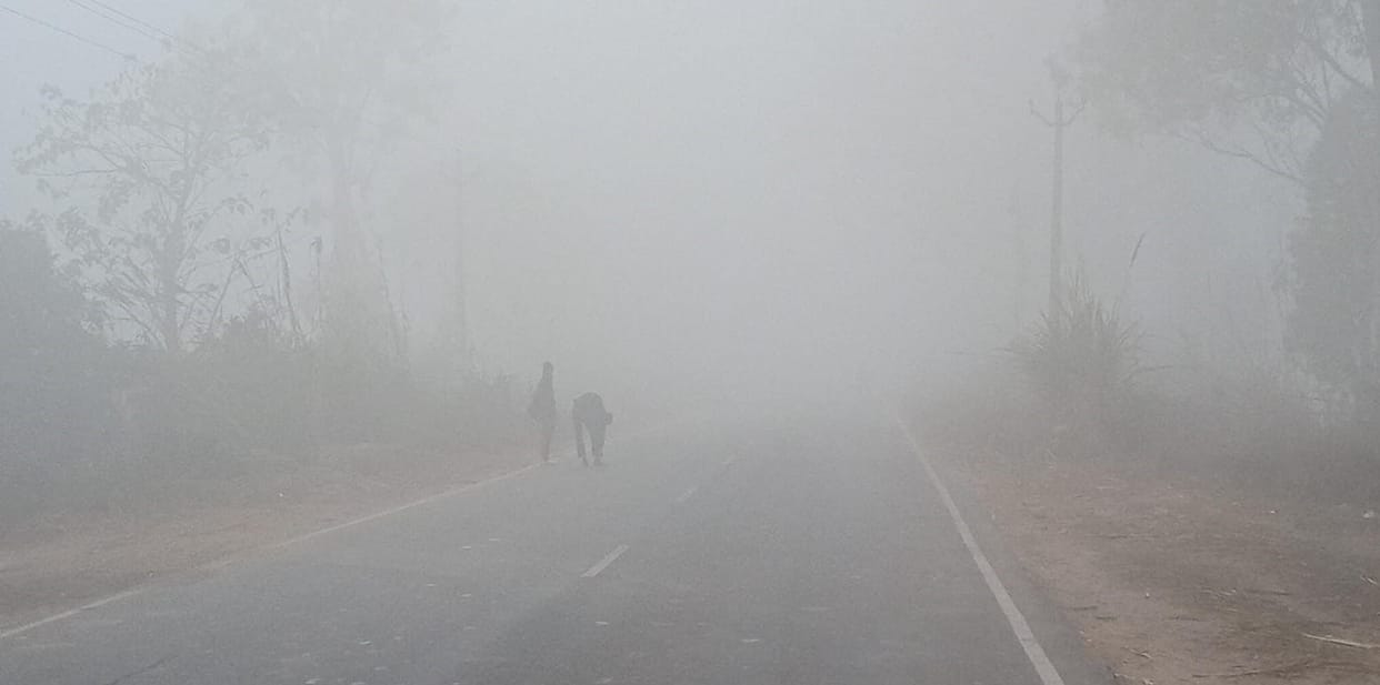 Dense fog in the morning, people shivering from cold