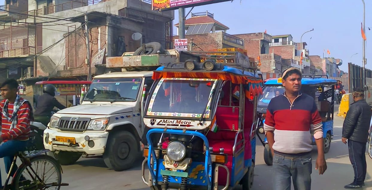 Encroachment on footpath and road, making it difficult for pedestrians to walk