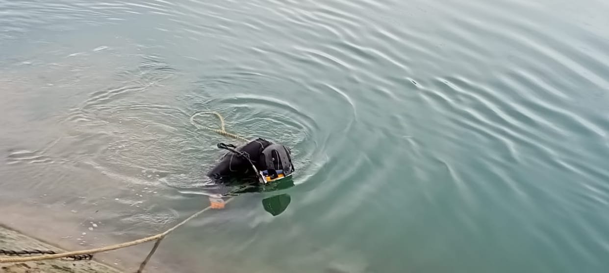 Divers descended into the power channel to investigate leakage.