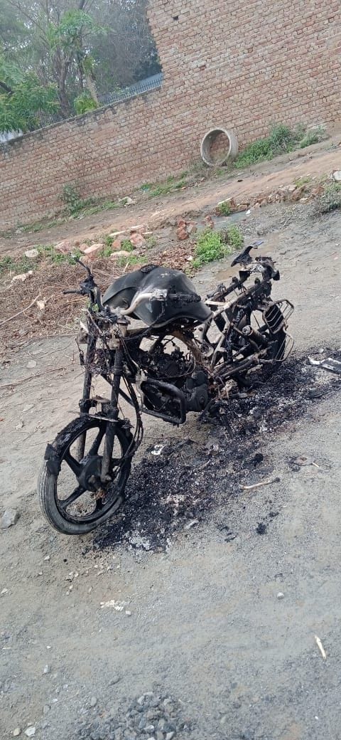 The bike parked outside the house was set on fire