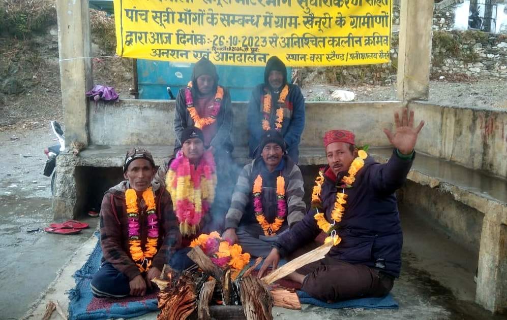 Villagers of Khainuri sitting on dharna by lighting bonfire