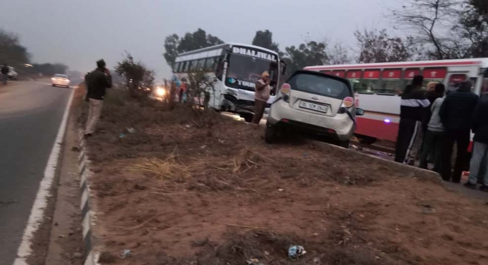 Car collides with bus after crossing divider, 5 injured