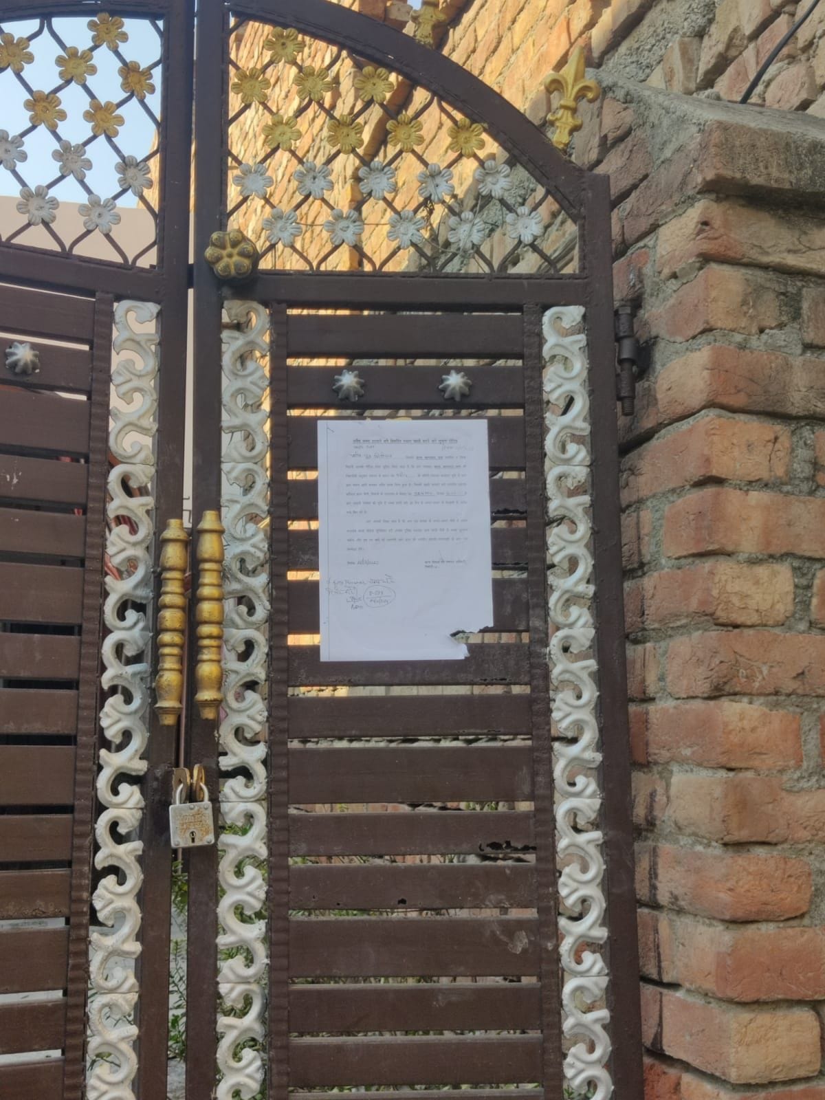 Demolition notice pasted outside ten illegal houses built on Shamlat land in village Kharak Khandayan