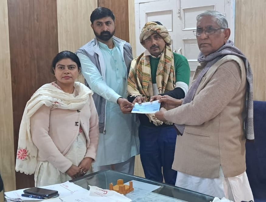 MLA distributed checks of Rs 5 lakh each to two beneficiaries