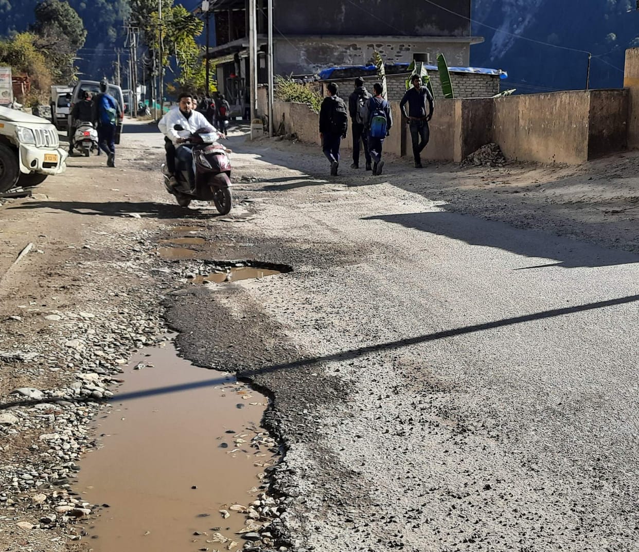 Potholes filled with mud emerge again, inviting accidents