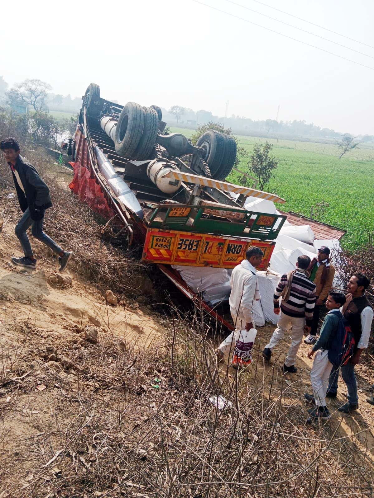 The truck went out of control and overturned on the highway, driver-helper narrowly escaped.