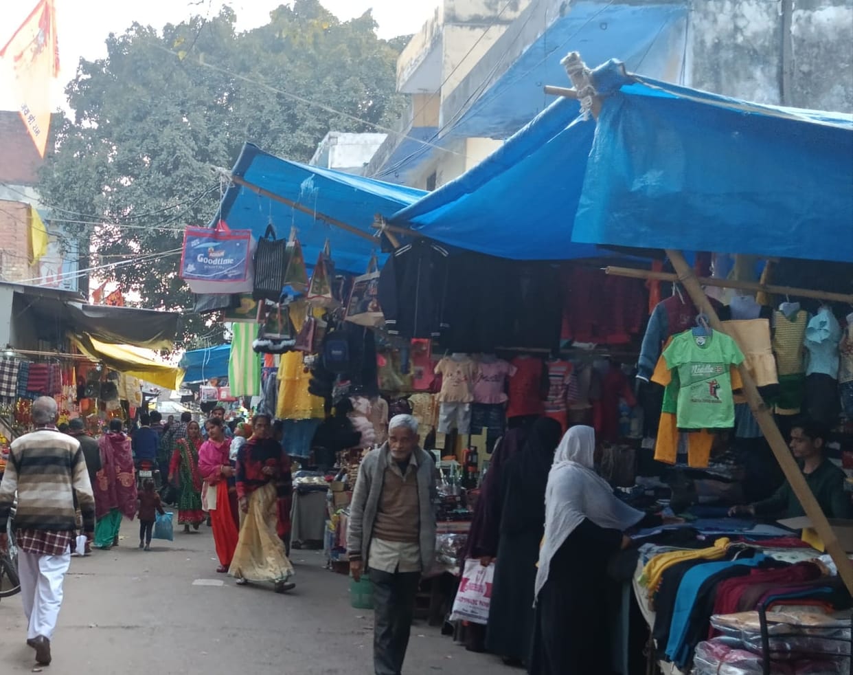 Goods from shops on the road, pedestrians in trouble