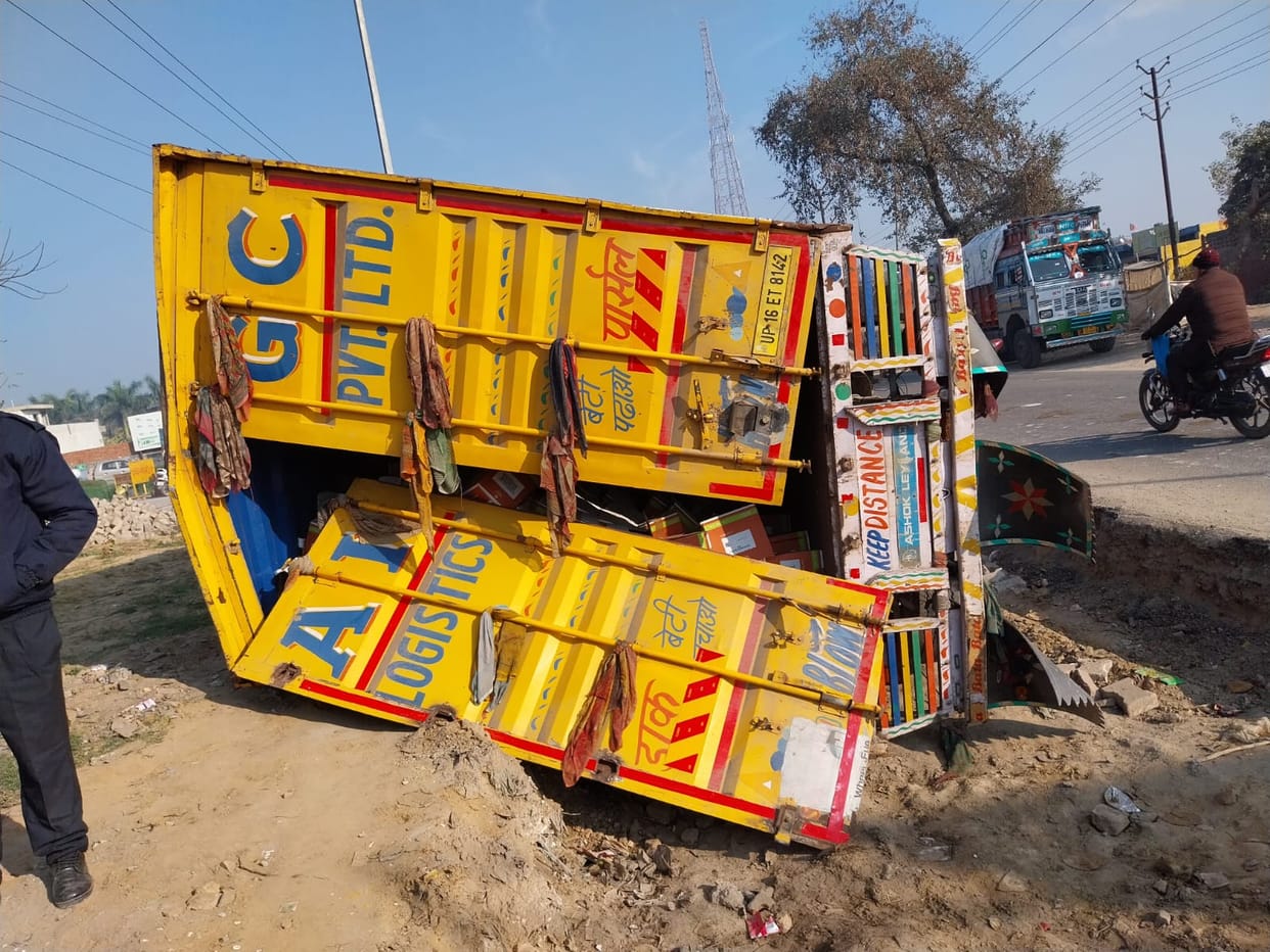 Truck full of liquor boxes went out of control and overturned