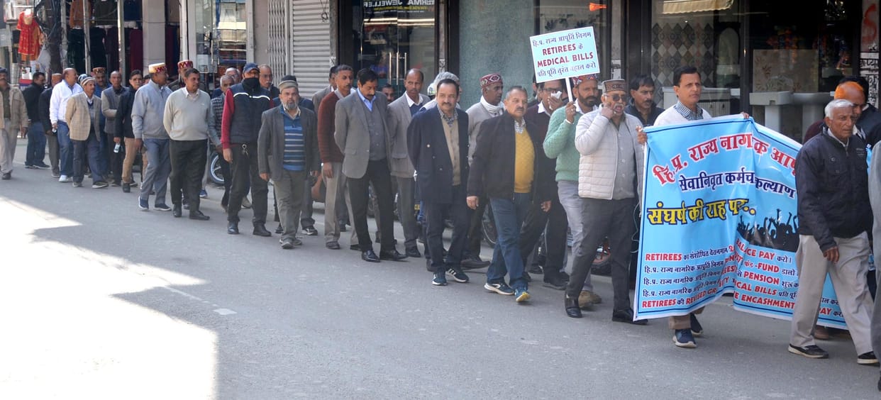 Retired employees of Supply Corporation demonstrated with placards in their hands