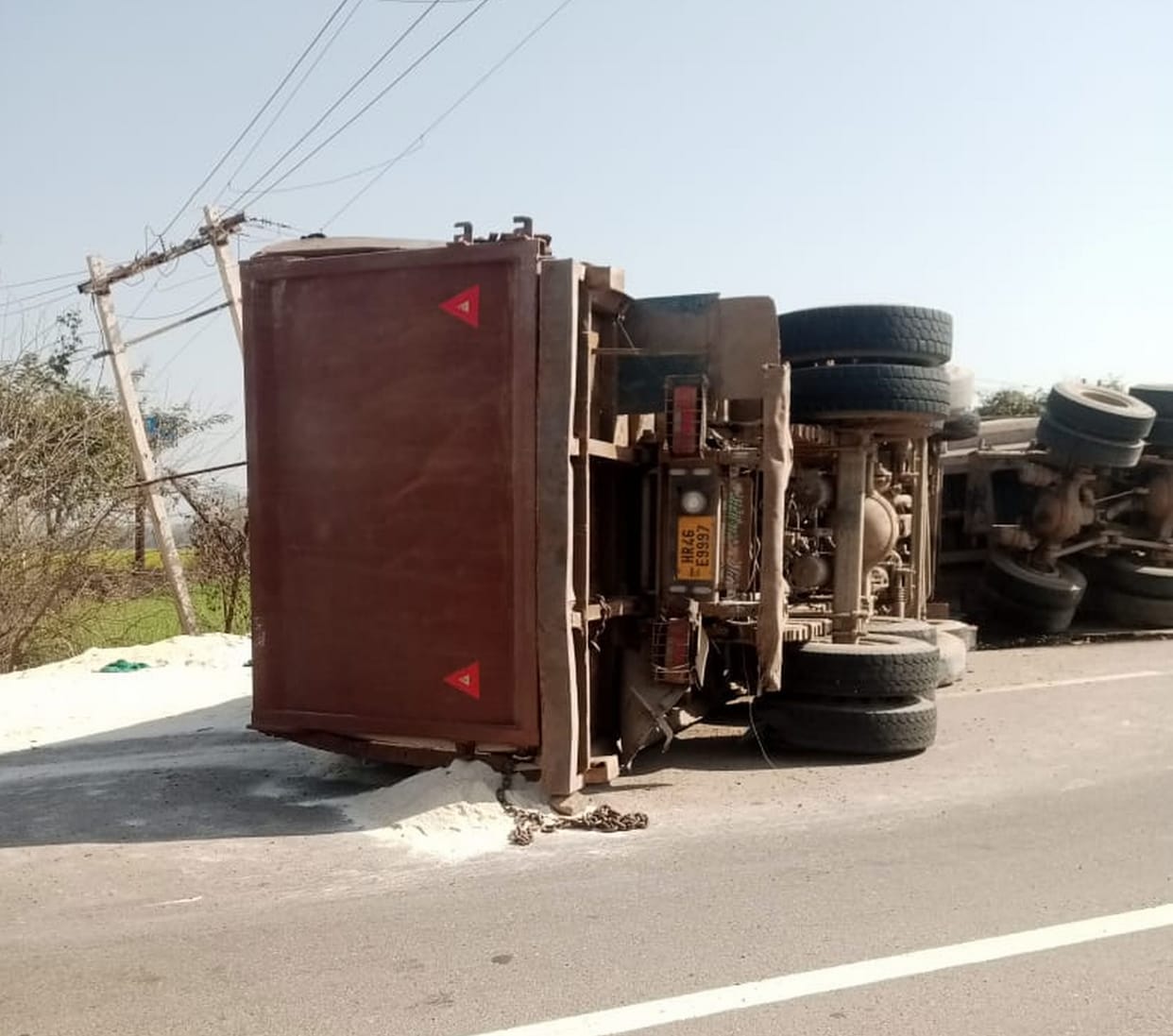 The truck became unbalanced due to tire burst and collided with another vehicle, driver-cleaner died