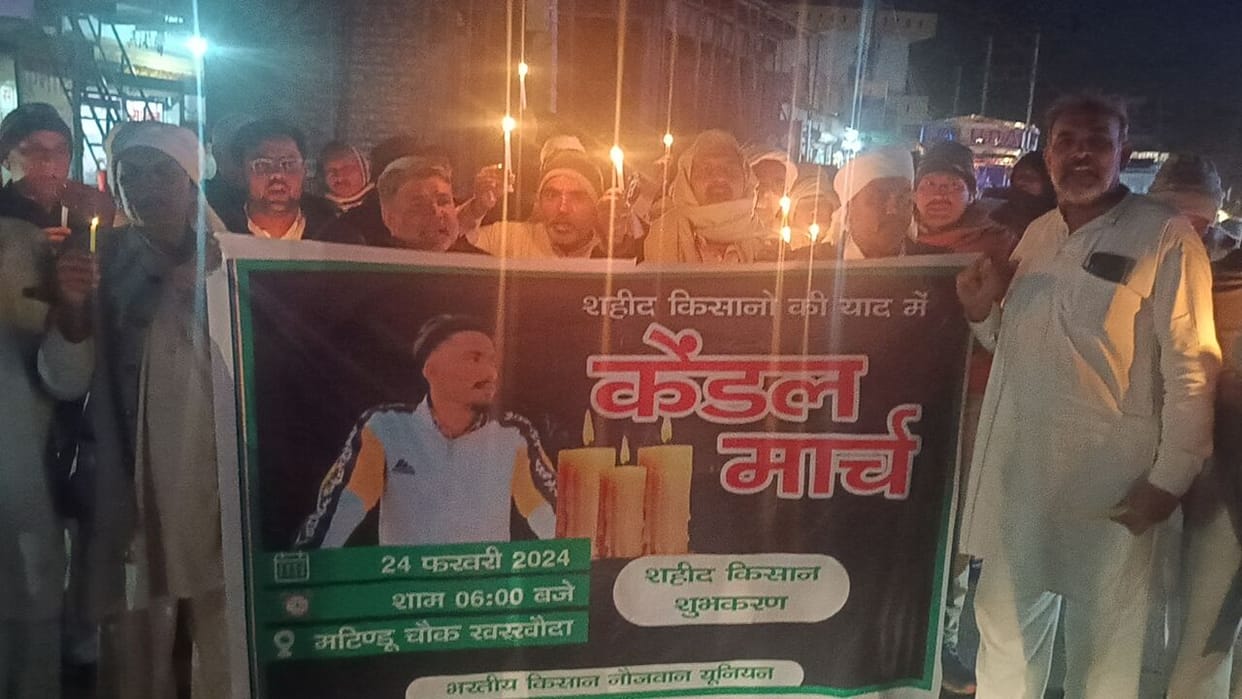 Members of Bharatiya Young Kisan Union took out a candle march
