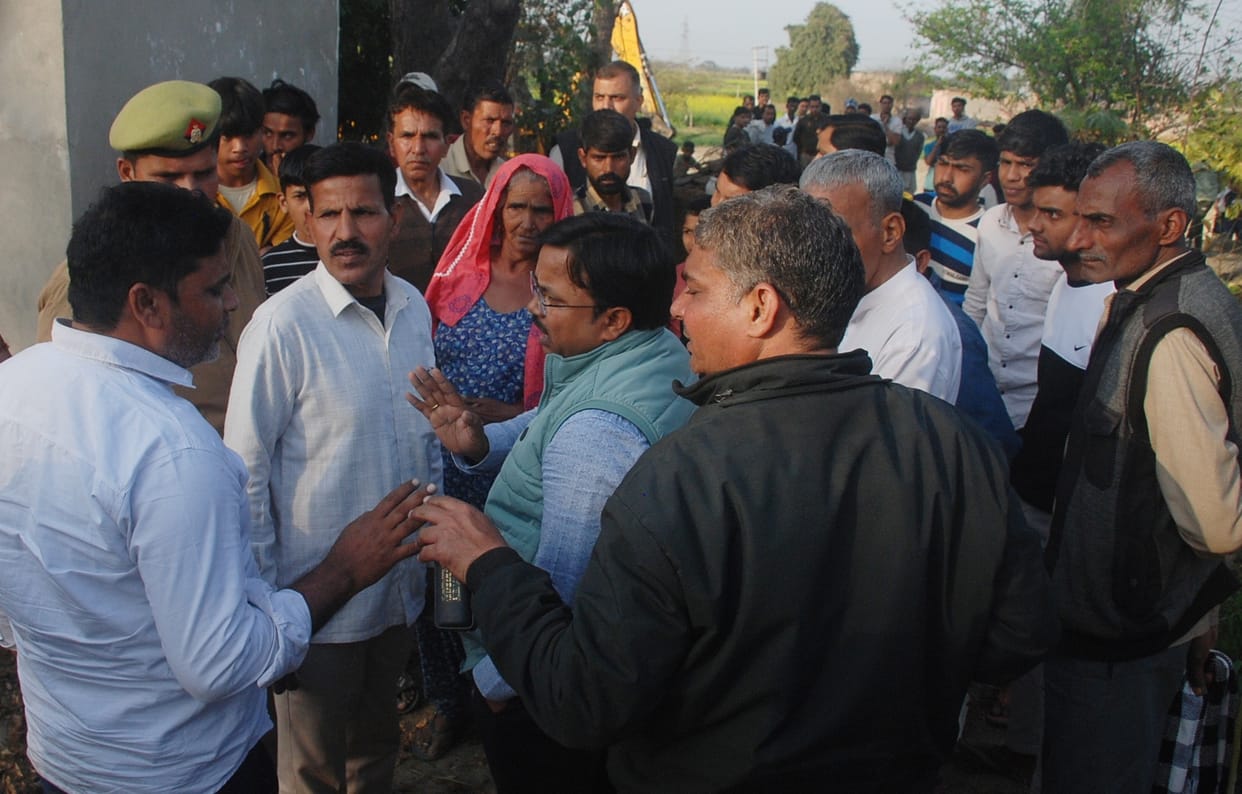 Uproar over demolition of house in Pabla, villagers stood in front of JCB