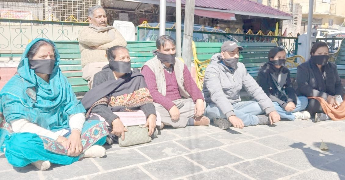 Congress councilors sitting on strike with black bands tied on their faces