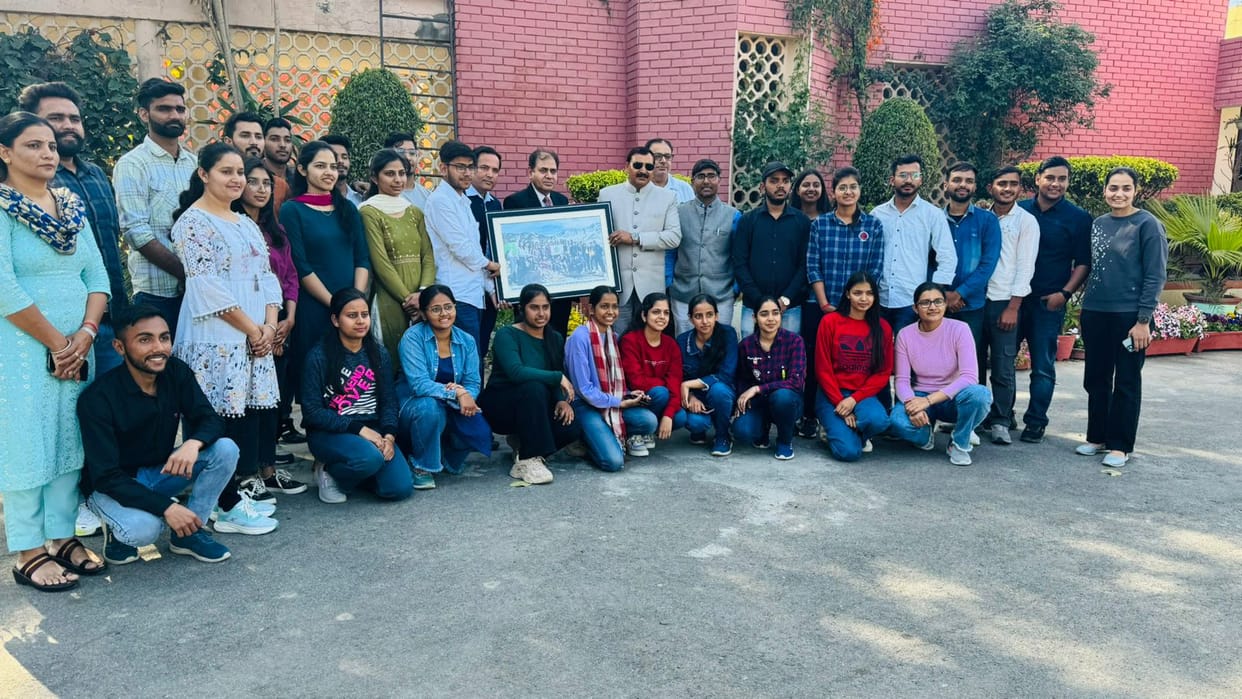 49 members of GJU hoisted the university flag on the peak of Triund Track.