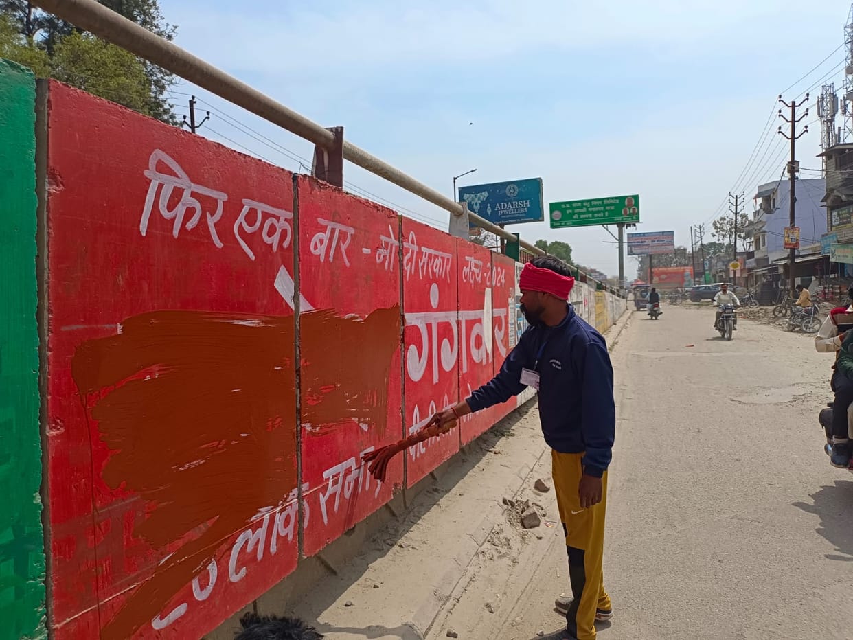 Signage covered with foil, propaganda written on walls removed by painting