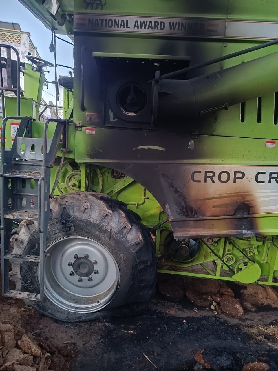 The combine parked outside the house was set on fire