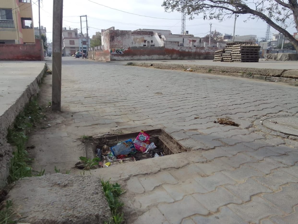 Open manholes near grain market and market committee office