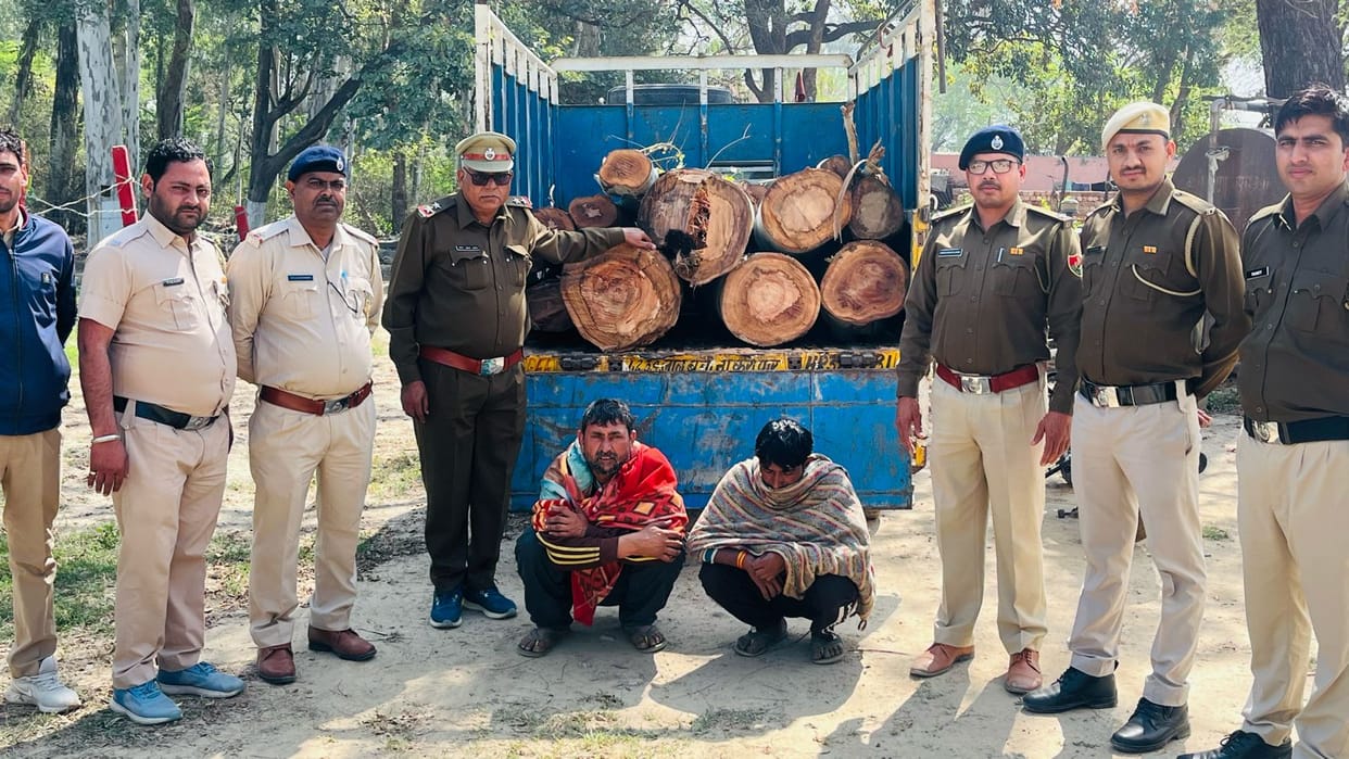 Forest department officials caught two accused of smuggling green trees by cutting them